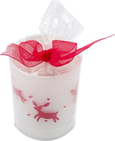 Vaso de cristal con vela y decorado navideño....